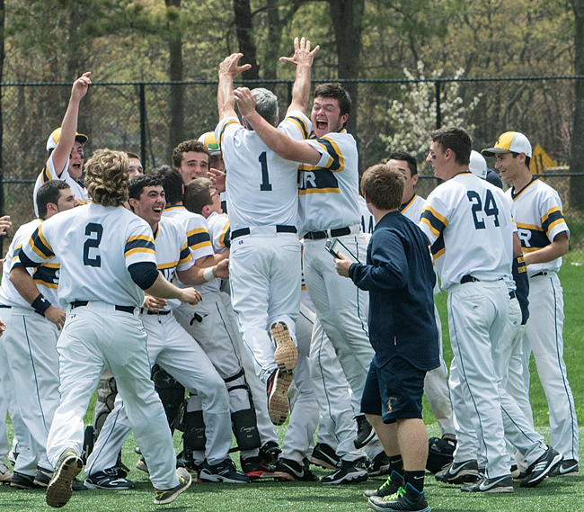 Coach Sal Mignano goes airborne during a celebration in May after the Wildcats clinched the League VII championship. (Credit: Robert O'Rourk, file)