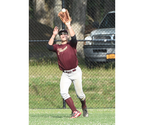 Riverhead Tomcats center fielder Mike Donadio snags a fly ball against Southampton June 19. Mike's twin brother Mark plays left field. (Credit: Robert O'Rourk)