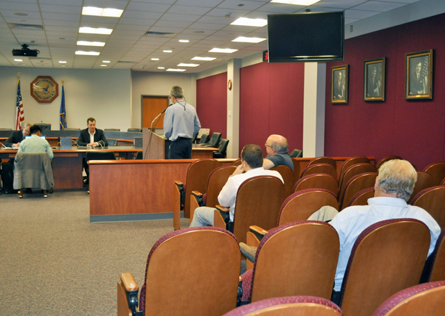 A handful of residents spoke at a forum Tuesday about the upcoming shortage of area codes. (Credit: Claire Leaden)