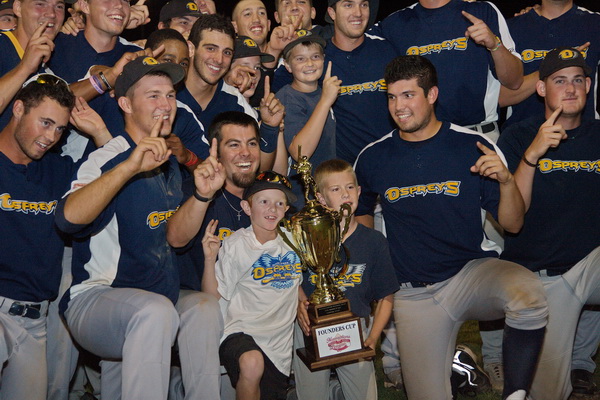 GARRET MEADE PHOTO | North Fork players posing for photos with the trophy they won as the first Hamptons Collegiate Baseball League champions.