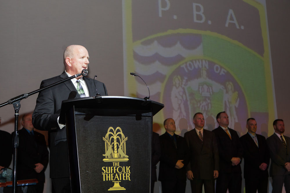 Officer Dennis Cavanaugh emcees the event. (Credit: Katharine Schroeder)