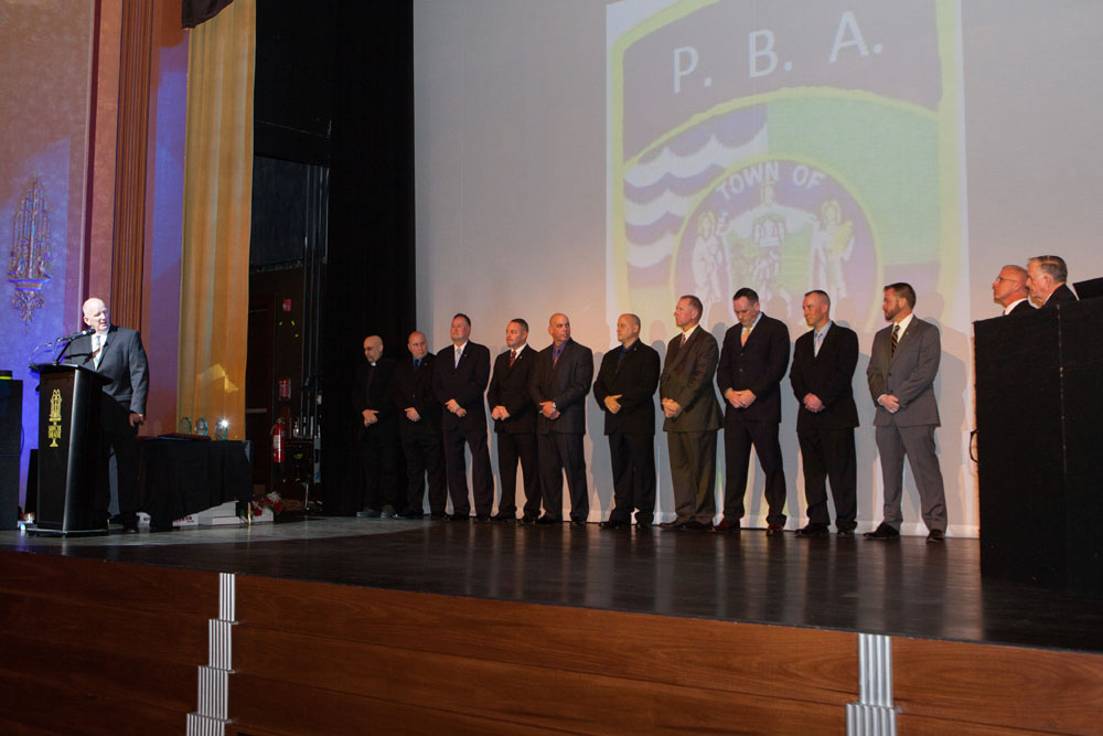 Officer Cavanaugh with the inductees. (Credit: Katharine Schroeder)