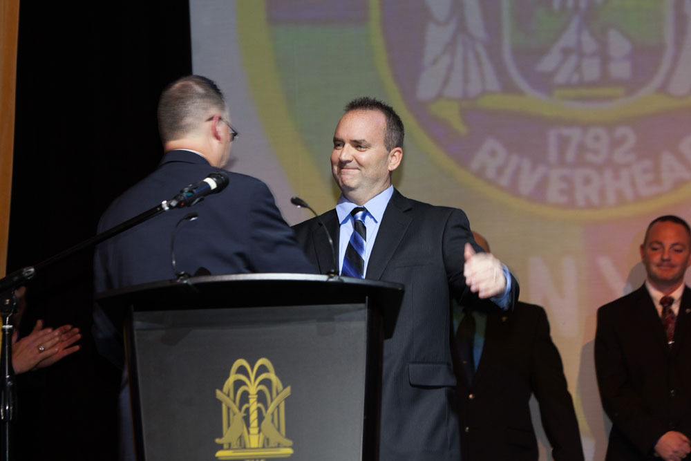 Dickson Palmer presents the PBA Member of the Year award to Officer Christopher Parkin. (Credit: Katharine Schroeder)