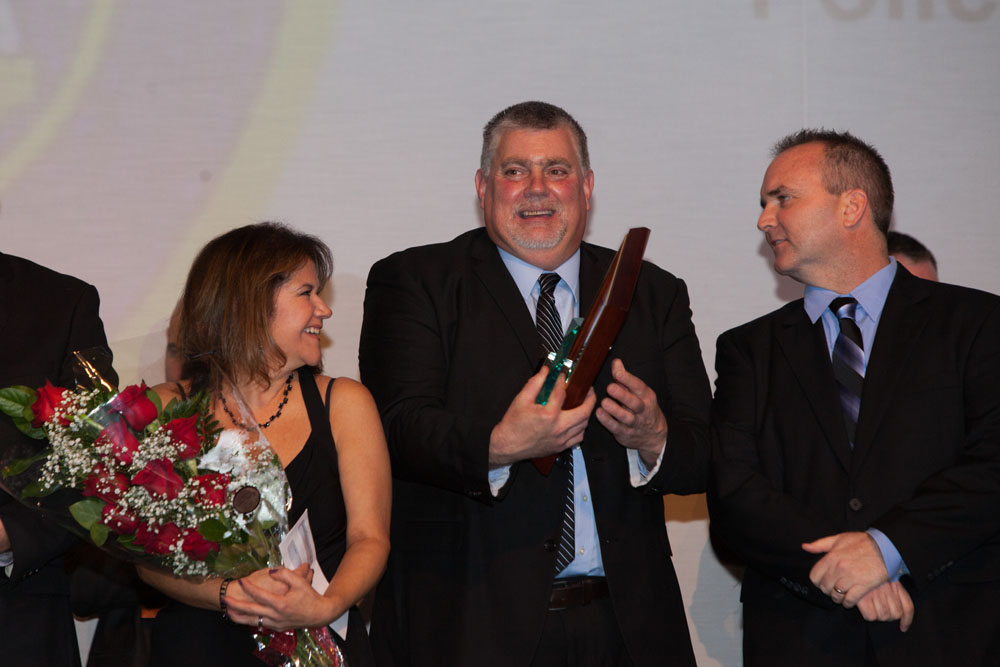 Retiree Officer Tim Hubbard (center). (Credit: Katharine Schroeder)