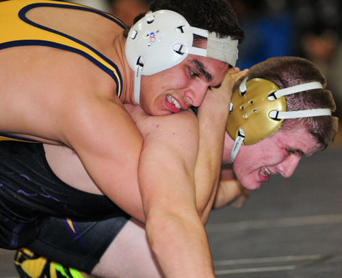 Shoreham-Wading River senior Dom Pirraglia (top) recorded four pins en route to the 182-pound league title Saturday. (Bill Landon photo)