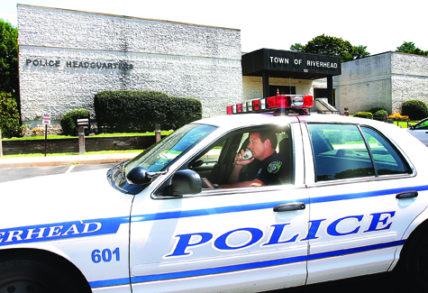 BARBARAELLEN KOCH FILE PHOTO | Riverhead police officer Tim Murphy outside the town's police headquarters on Howell Avenue.