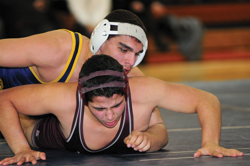 Shoreham-Wading River senior Dom Pirraglia (top) will wrestle in the 182-pound bracket of the state tournament beginning Friday.