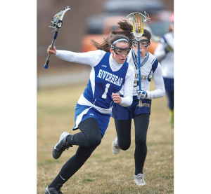 GARRET MEADE PHOTO | Carrera scored four goals with two assists in the Blue Waves lacrosse season-opener in March.