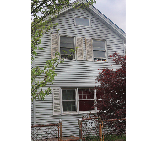 Riverhead Town is taking the homeowner of 331 Hamilton Avenue — and four other properties in town — to court for several reported violations related to overcrowding. (Credit: Barbaraellen Koch)