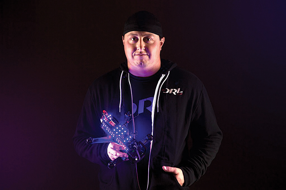 DRL pilot Steve Zoumas poses with his winning racing drone. (Credit: Courtesy, Drone Racing League)