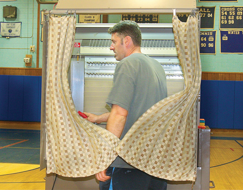 BARBARAELLEN KOCH PHOTO | Tony Yarusso of Riverhead was one of the last people to cast his vote a a minute before 9 p.m.