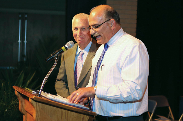 Riverhead track and field coach Sal Loverde speaks in honor of Mr. Groth last week at the end of the school's varsity awards ceremony. (Credit: Riverhead Schools)