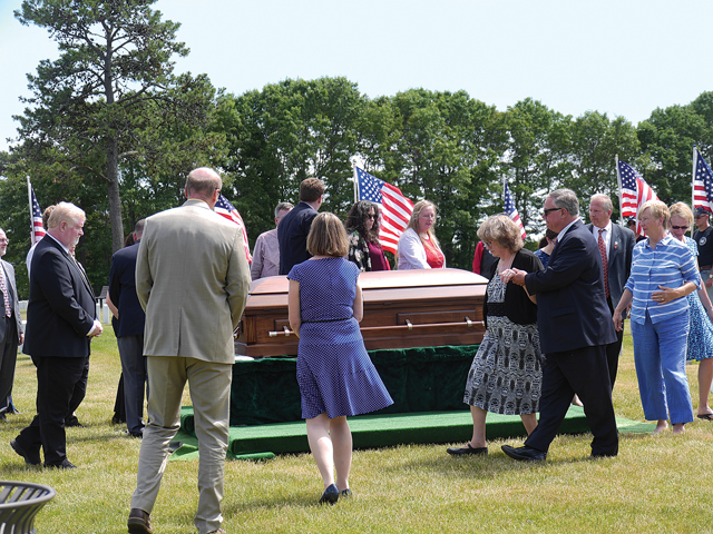 Family and friends circle the casket of U.S. Marine John Prince during his funeral Friday. (Credit: Krysten Massa)