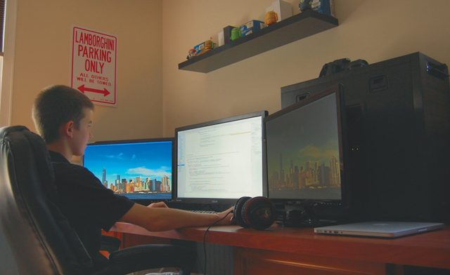 Jack Higgins works on an app on his ‘super computer' at his home. (Credit: Nicole Smith)