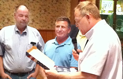 MICHAEL WHITE PHOTO | Rich Podlas (left) and Chuck Thomas (middle) were honored for their service to the Behr family at the first dinner in 2011.