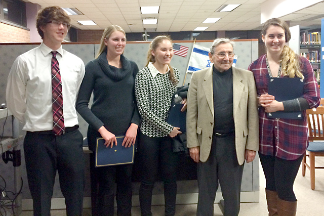 Riverhead High School students Jeremy Bornstein, Amanda Baron, Mieko Vail and Samantha Dunn with Holocaust survivor Werner Reich. (Credit: Riverhead School District)