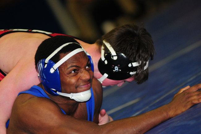 Riverhead's Raheem Brown won a 3-1 decision at 170 pounds against Hills East's Griffin Arcuri. (Credit: Bill Landon)