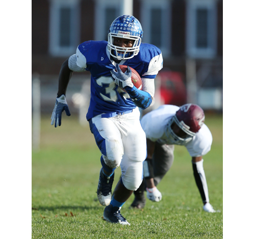 Riverhead's Raheem Brown picks up a big gain in the first half of Saturday's win over Deer Park. (Credit: Daniel De Mato)