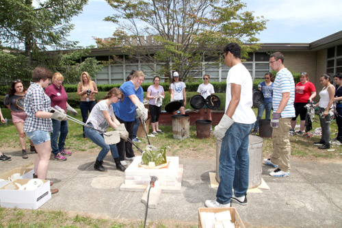 Riverhead High School students working with a kiln and learning about Raku. (Credit: Courtesy)