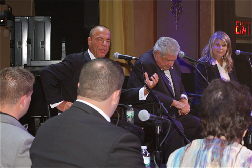 BARBARAELLEN KOCH PHOTO | Town Board candidate Anthony Coates, from left, and Town board members John Dunleavy and Jodi Giglio address the moderators at Monday's debate at the Suffolk Theater.