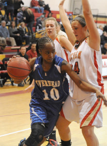 ROBERT O'ROURK PHOTO | Naysha Trent of Riverhead searching for dribbling room around Sachem East's Emily Carmel.