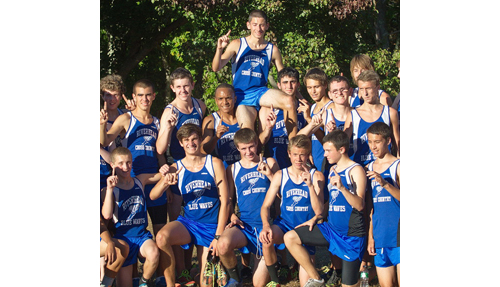 GARRET MEADE PHOTO | With team captain Joe Gattuso raised on the shoulders of teammates, the Blue Waves posed for photographs after completing a 5-0 dual-meet season on Tuesday. Riverhead is a league champion for the first time in 15 years.