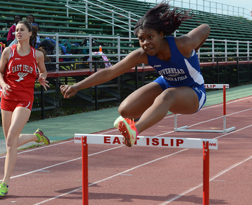 ROBERT O'ROURK PHOTO | Denise Brunskill of Riverhead took first place in the 100-meter high hurdles in 17.9 seconds.
