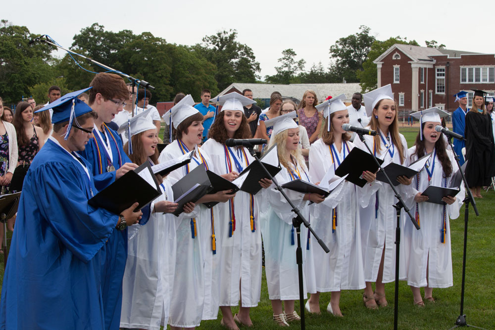 Senior members of RHS Chamber Choir sing The Star Spangled Banner.