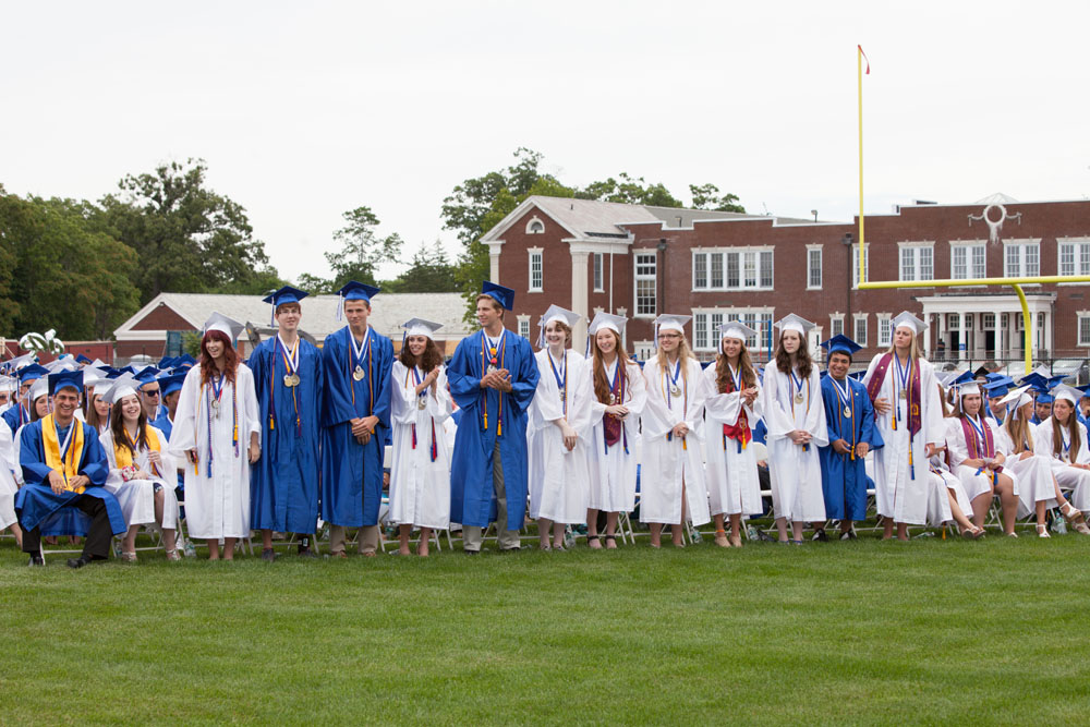Students stand to be recognized for their achievements.