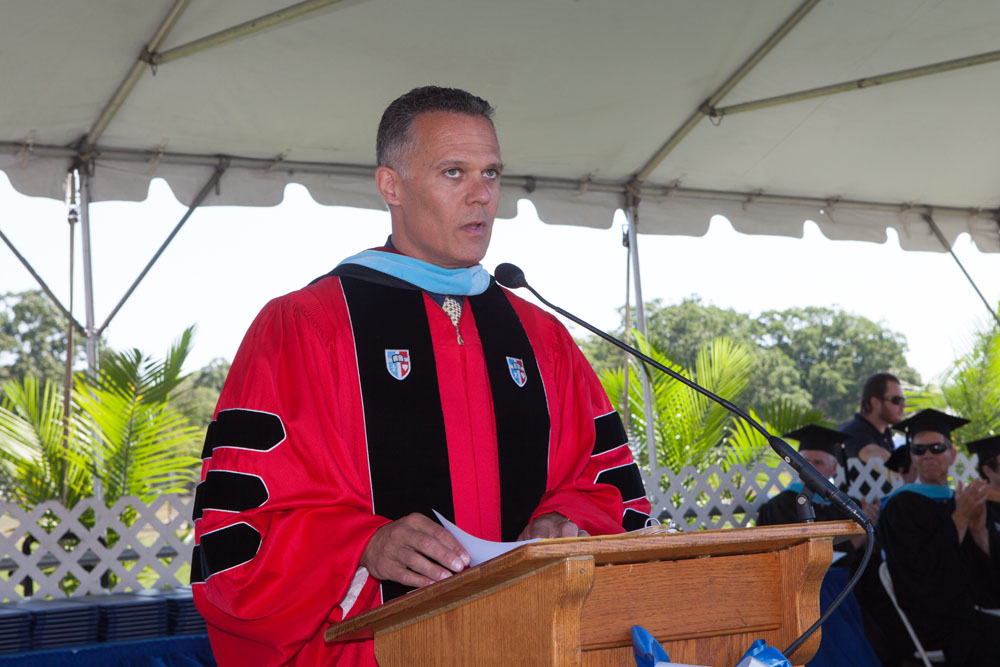 High School principal Charles Regan speaks at Riverhead High School's 2016 graduation ceremony. (Credit: Katharine Schroeder)