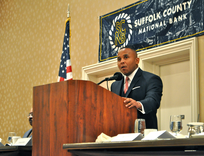 RACHEL YOUNG PHOTO | Rashad Robinson, executive director of ColorofChange.org, speaks at Monday's Martin Luther King, Jr. Memorial Breakfast.