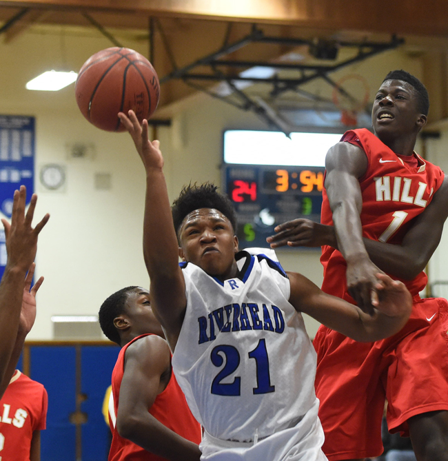 Riverhead guard Sharron Trent goes up for a basket against Hills West Thursday. (Credit: Robert O'Rourk)