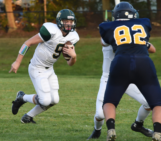 Mercy quarterback Kevin Santacroce carries the ball against Shoreham. (Credit: Robert O'Rourk)