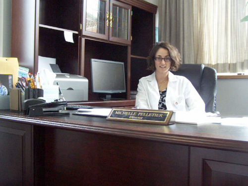 COURTESY PHOTO | Michelle Pelletier at her desk in downtown Riverhead's Long Island Science Center. COURTESY PHOTO | Michelle Pelletier at her desk in downtown Riverhead's Long Island Science Center.
