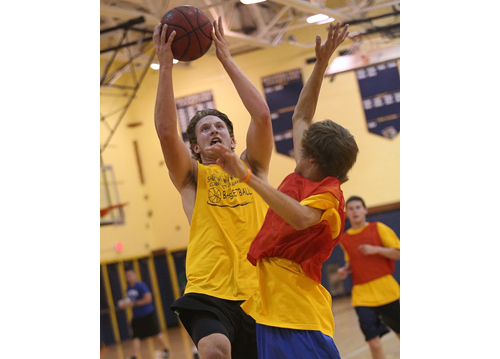 Dan Hughes, attacking the basket during Shoreham-Wading River's intrasquad scrimmage last Thursday night, has ball skills to go with his 6-foot 5-inch frame. (Credit: Garret Meade)