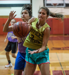 ROBERT O'ROURK PHOTO | Jessica McCormick of Shoreham-Wading River battling for a loose ball under the basket.