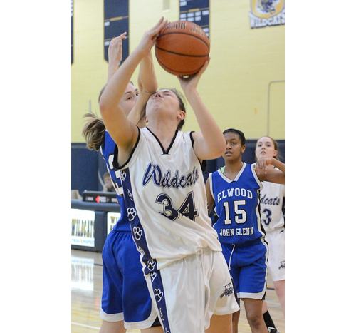 ROBERT O'ROURK PHOTO | Shoreham-Wading River's Taylor Whiffen took an elbow to the head from Elwood/John Glenn's Jillian Del Grasso while shooting.