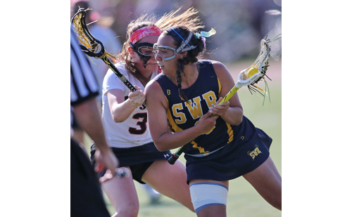 Shoreham-Wading River's Manuela Cortes is guarded closely by Mount Sinai's Mary Ellen Carron. (Credit: Garret Meade)