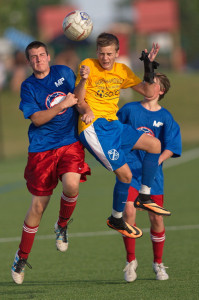 GARRET MEADE PHOTO | Joseph Cusano of Shoreham-Wading River, flanked by Miller Place's Jordan Hassel, left, and Brendan Murphy, challenging for a head ball.