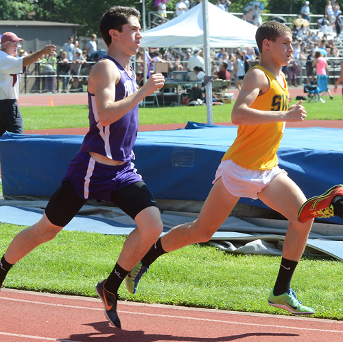 ROBERT O'ROURK PHOTO | Port Jefferson's James Burke, left, ran around Shoreham-Wading River's Ryan Udvadia about 1,200 meters into the 1,600-meter final.