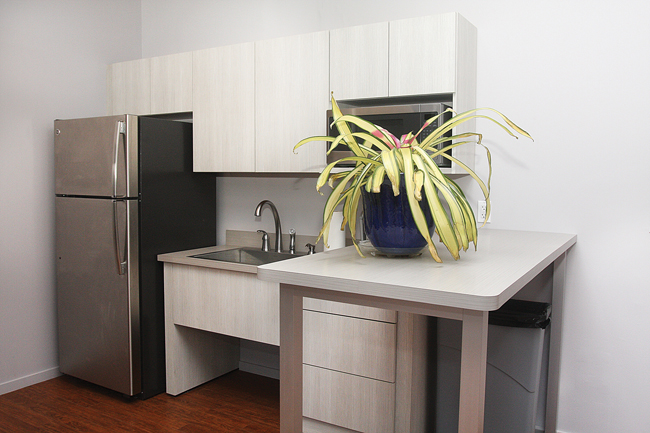 The second-floor kitchen is meant to be shared by tenants. (Credit: Barbaraellen Koch)