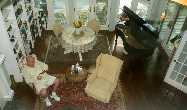 The view from Ms. Deegan's second-floor office as Mr. Deegen relaxes in the living room. (Credit: Barbaraellen Koch)