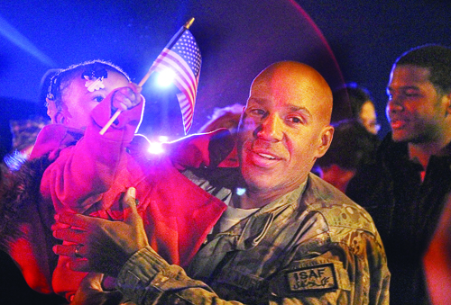 PAUL SQUIRE FILE PHOTO | Tech. Sgt. Fred Ligon received a warm welcome from friends and family after arriving home Dec. 4 from a tour in Afghanistan.