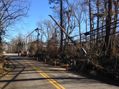 PAUL SQUIRE PHOTO | A LIPA crew was working on a power line knocked over from the high winds that swept through the area overnight.