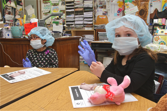 Karisha Mazariegos-Guerrero and Summer Realander work on their teddy bears.