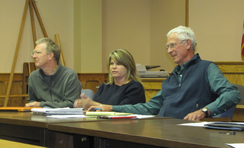 From left, Landmarks Preservation Commission member Cliff Baldwin, Riverhead Town Councilwoman Jodi Giglio and commission chair Richard Wines listen to speakers at Monday's commission meeting, where a proposal to make a six-mile stretch of Main Road a National Register Historic Place was withdrawn. (Credit: Tim Gannon)