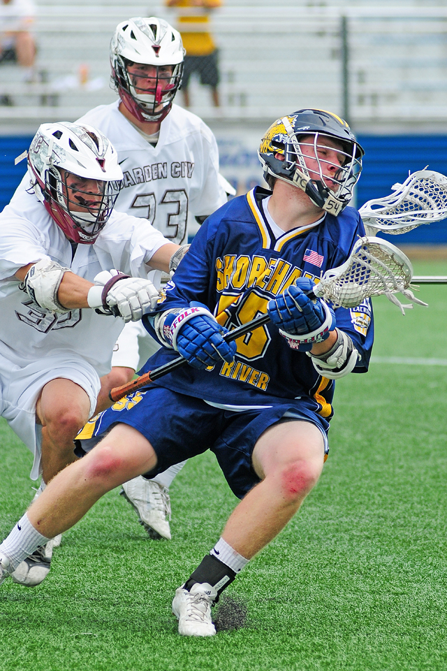 Kevin Cutinella cuts the corner in Shoreham Wading River's Long Island Championship win Saturday. (Credit: Bill Landon)