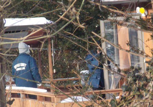 Police investigate the scene at 27 12th Street Monday morning following a double-murder and suicide. (Credit: Joe Pinciaro)