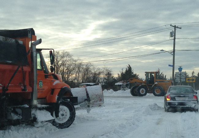 Highway crews clear snow near Hulse Landing Road and Route 25A in Wading River Wednesday morning. (Credit: Joe Werkmeister)