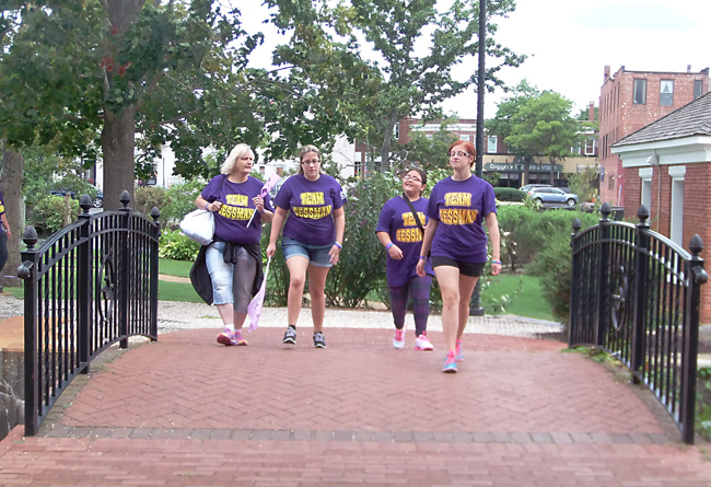 Walkers cross the bridge in downtown Riverhead during Saturday's walk. (Credit: Joe Werkmeister)